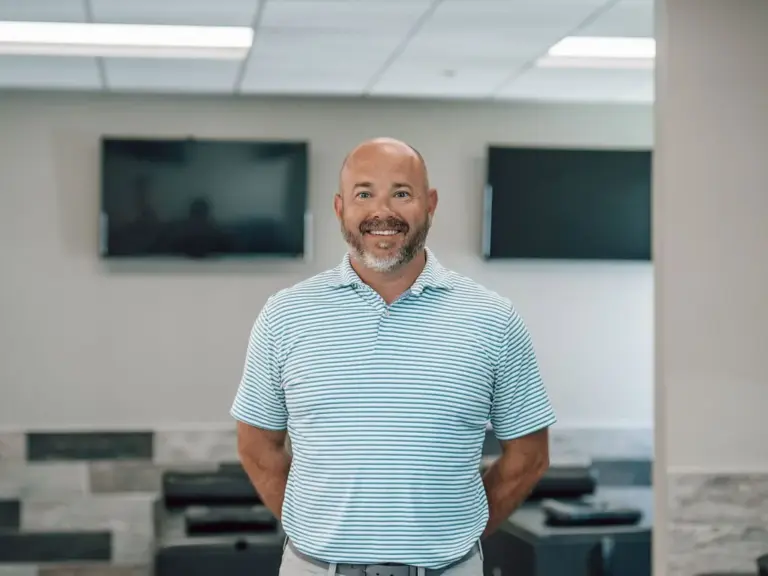 Dr. Travis Bradley standing in the treatment room at Eastern Oklahoma Wellness Center in Tulsa