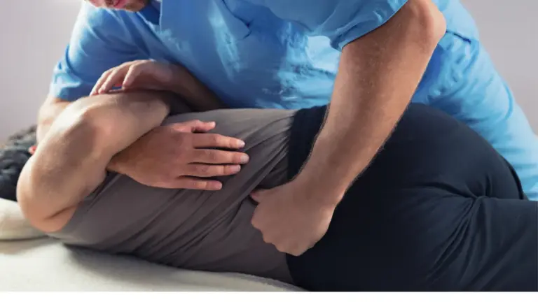 A chiropractor applying a side-lying adjustment to a patient lower back